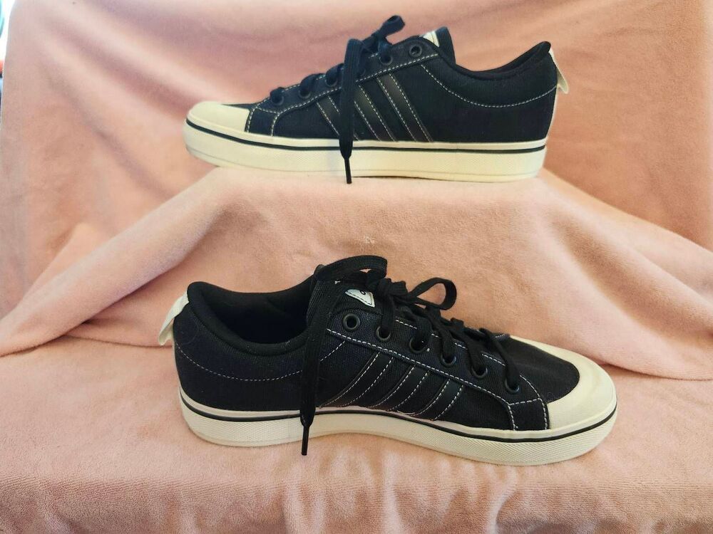 Adidas Bravada 2.0 sneakers featuring a black canvas upper and a distinctive rub